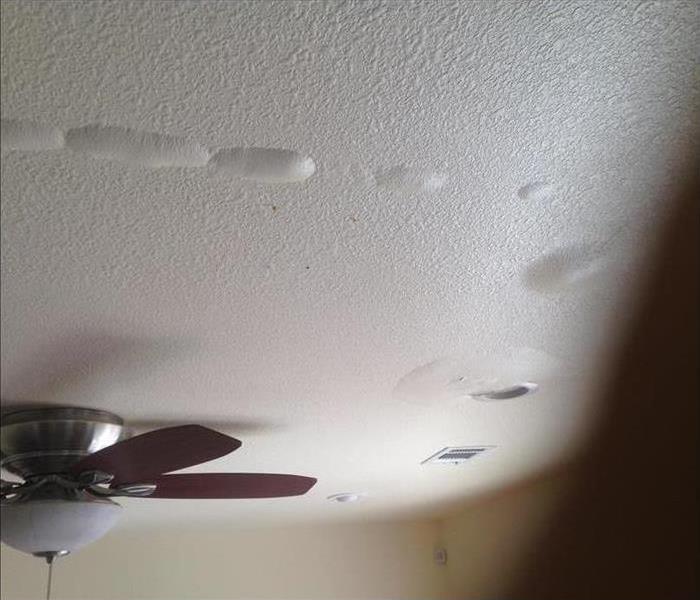 White ceiling with visible signs of water damage