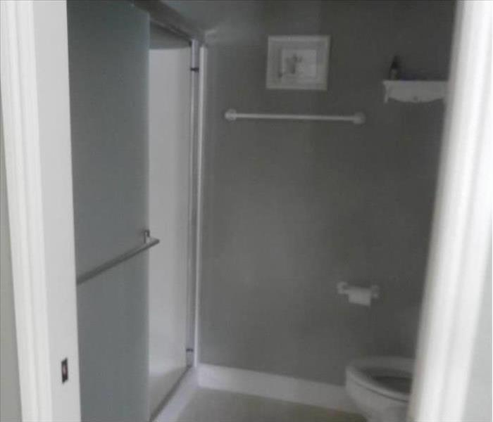 Soot covered bathroom with toilet