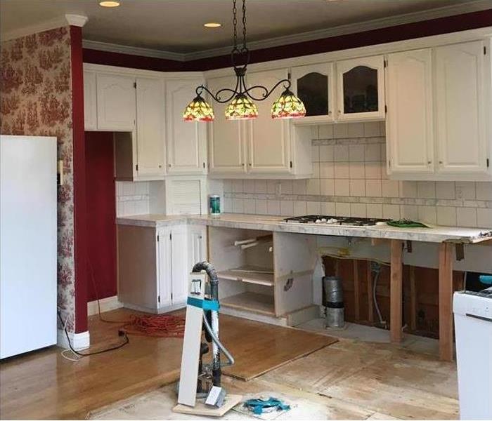 Kitchen island removed with cabinets in tact